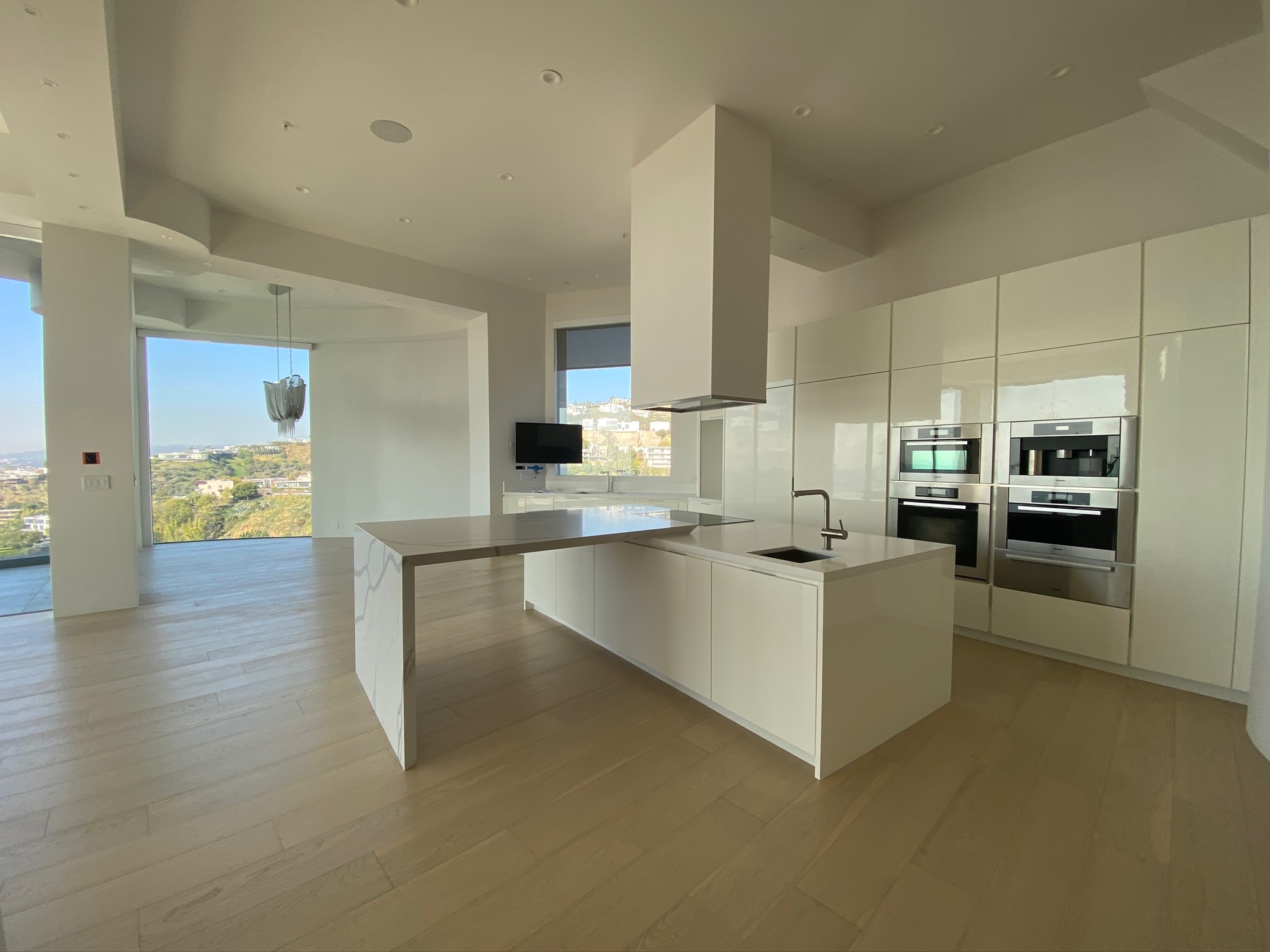 Modern white kitchen completed by RMK Builders